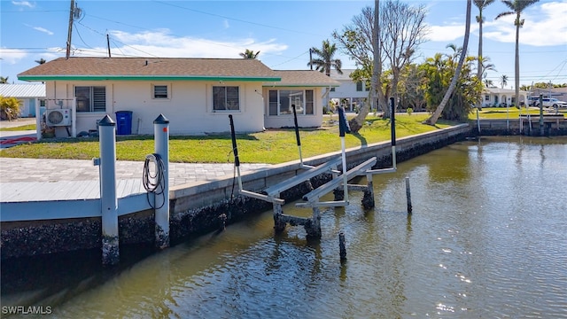 view of dock with a water view, ac unit, and a lawn