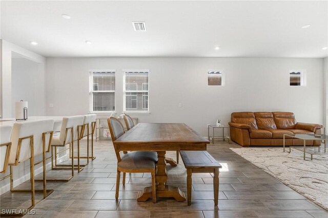 dining area with hardwood / wood-style floors