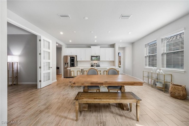 dining room featuring light wood-type flooring