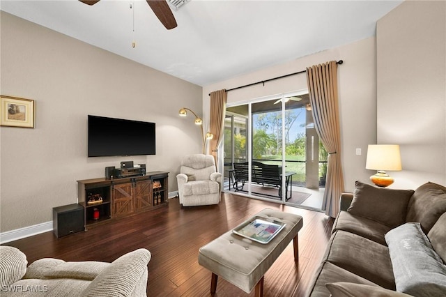 living room with dark hardwood / wood-style floors and ceiling fan