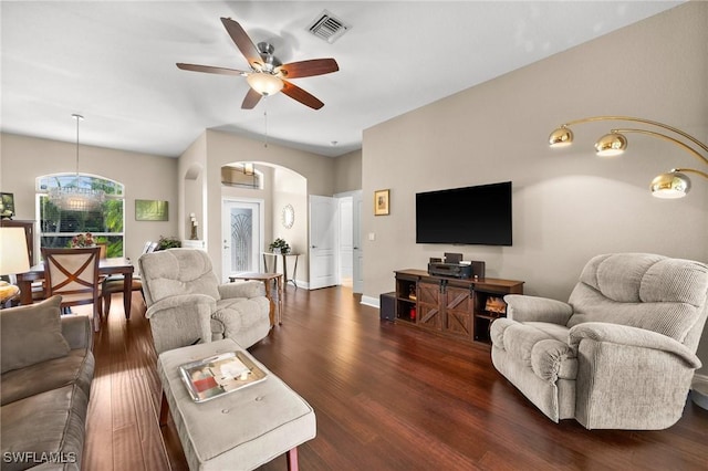 living room with dark wood-type flooring and ceiling fan