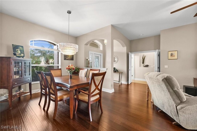 dining area with ceiling fan and dark hardwood / wood-style floors