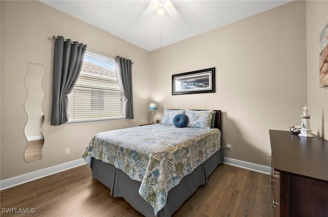 bedroom featuring dark wood-type flooring and ceiling fan