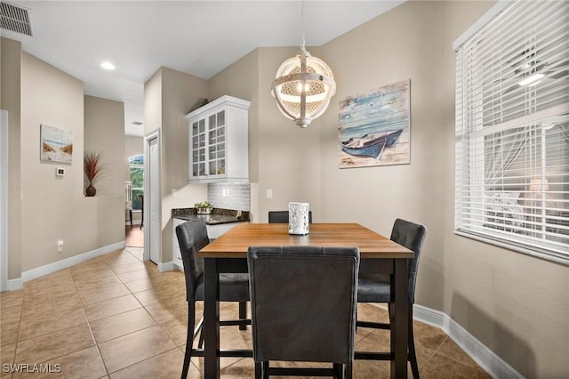 dining space with light tile patterned floors