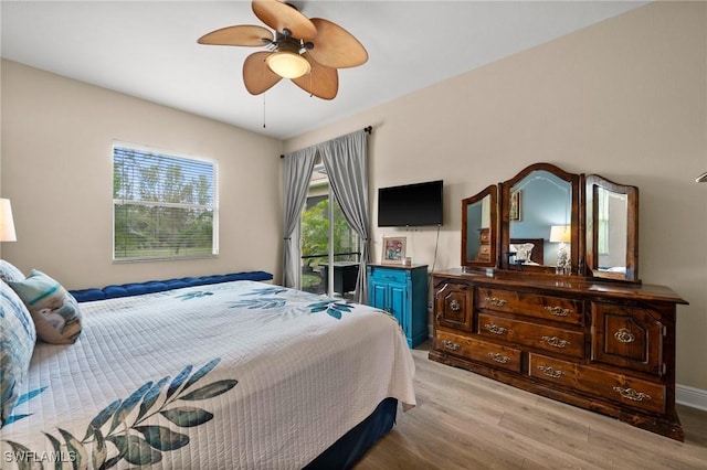 bedroom with light hardwood / wood-style floors and ceiling fan