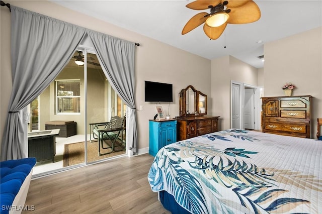 bedroom with ceiling fan, a closet, access to exterior, and light hardwood / wood-style flooring