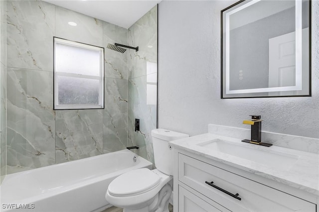 full bathroom with vanity, toilet, and tiled shower / bath combo