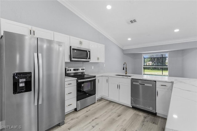 kitchen with sink, crown molding, stainless steel appliances, light stone counters, and white cabinets