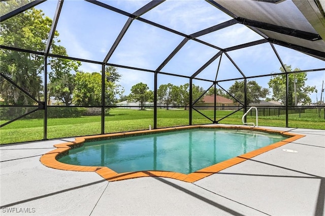 view of swimming pool featuring a lanai, a yard, and a patio area