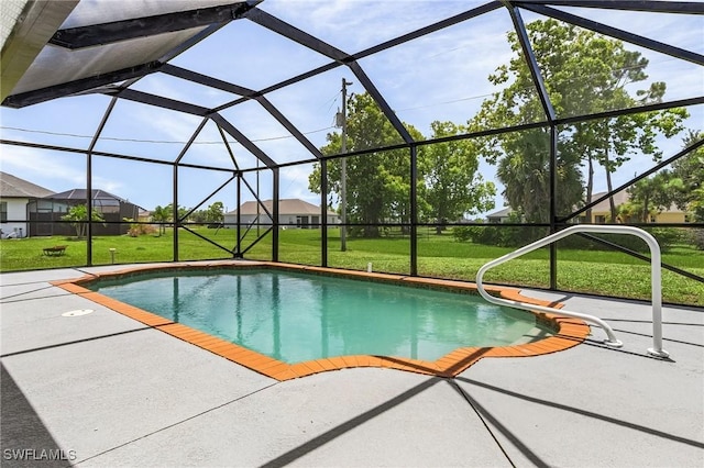 view of swimming pool featuring a lanai, a patio area, and a lawn