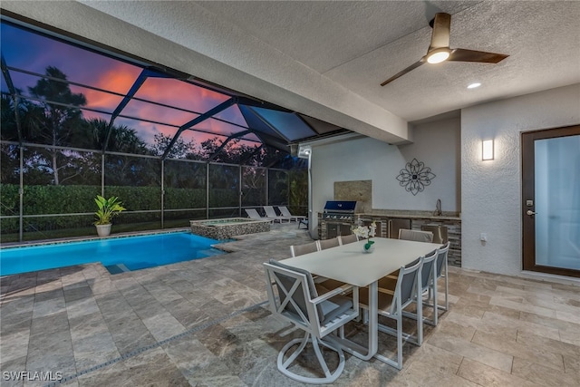 4641 Azalea Dr, Naples, FL 34119 - view of pool featuring a patio, glass enclosure, a ceiling fan, area for grilling, and an outdoor kitchen