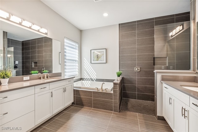 4641 Azalea Dr, Naples, FL 34119 - bathroom with tile patterned flooring, a tile shower, a sink, two vanities, and a bath