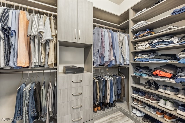 4641 Azalea Dr, Naples, FL 34119 - walk in closet with wood finished floors
