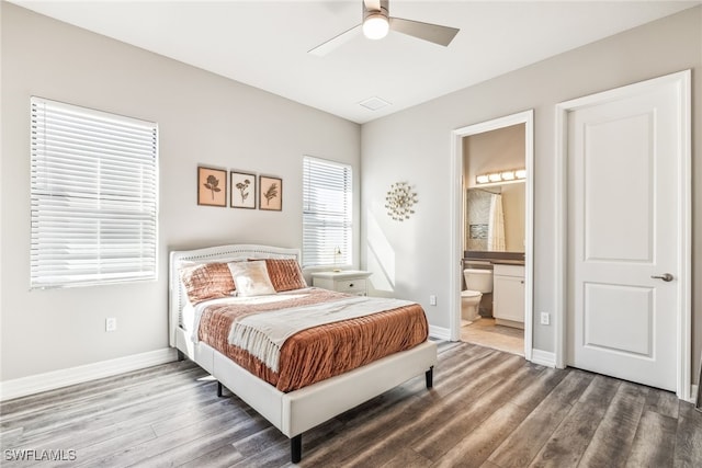 4641 Azalea Dr, Naples, FL 34119 - bedroom featuring a ceiling fan, connected bathroom, baseboards, and wood finished floors