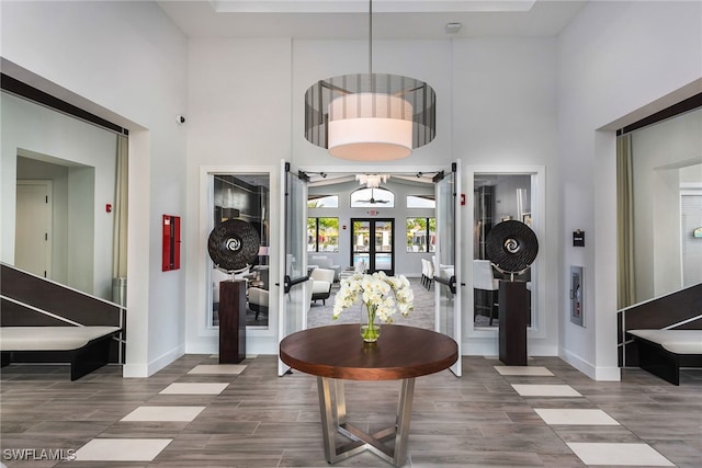4641 Azalea Dr, Naples, FL 34119 - entrance foyer featuring baseboards, a towering ceiling, and french doors
