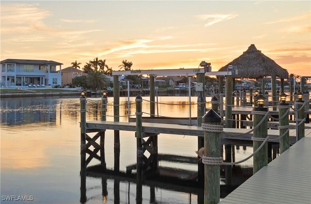 dock area with a gazebo and a water view