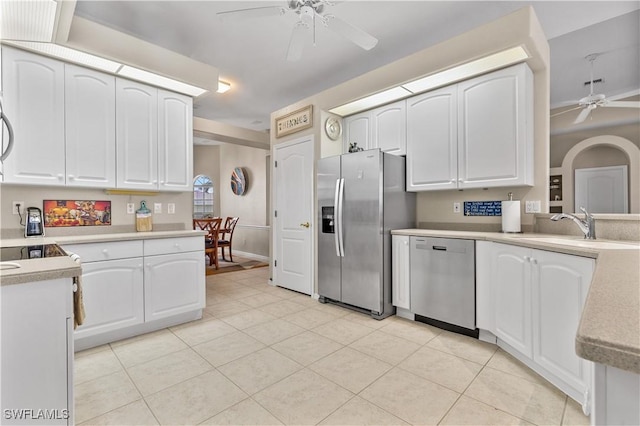 kitchen featuring white cabinetry, sink, stainless steel appliances, and ceiling fan