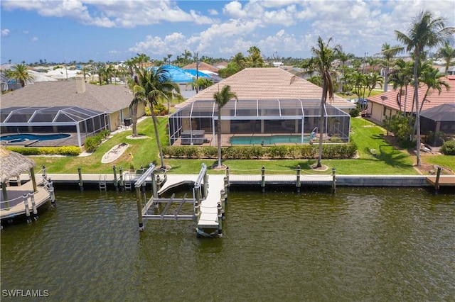 dock area with a water view, a yard, and a lanai