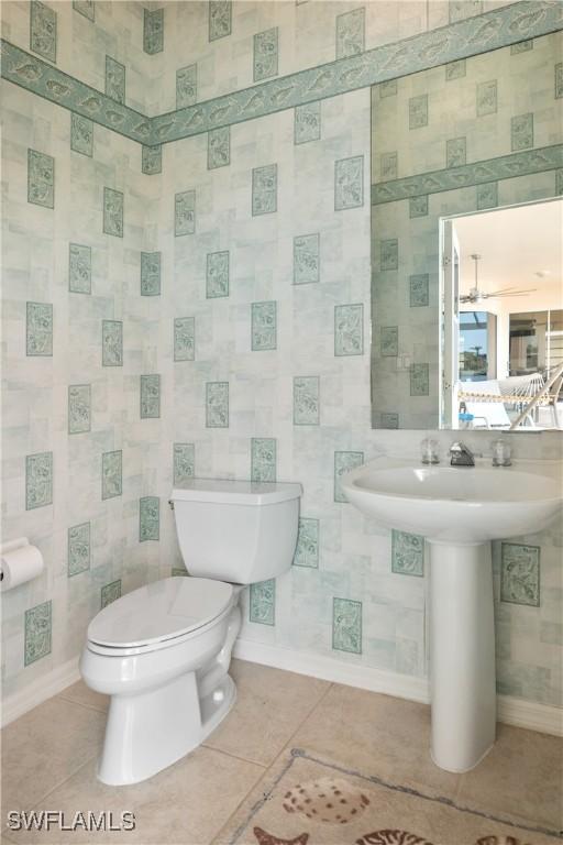 bathroom with tile patterned floors and toilet