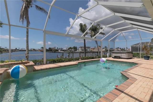 view of swimming pool with a hot tub, a water view, glass enclosure, and a patio area