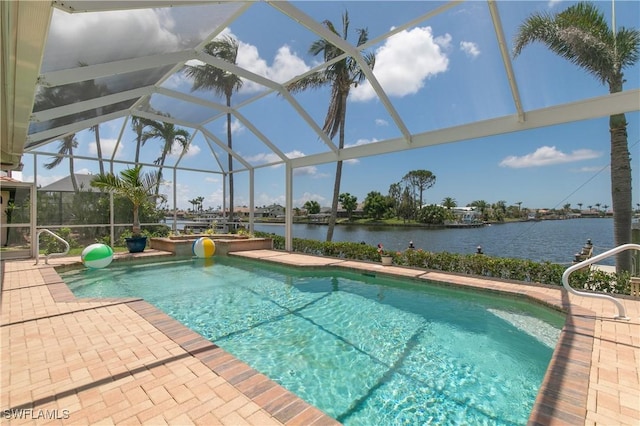 view of swimming pool featuring a water view, a patio area, and glass enclosure