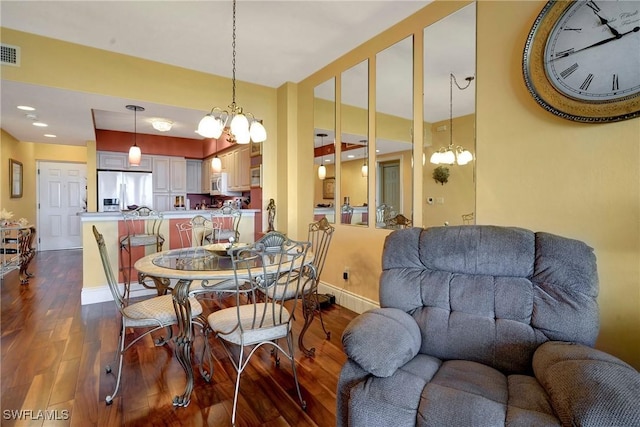 dining space with dark wood-type flooring