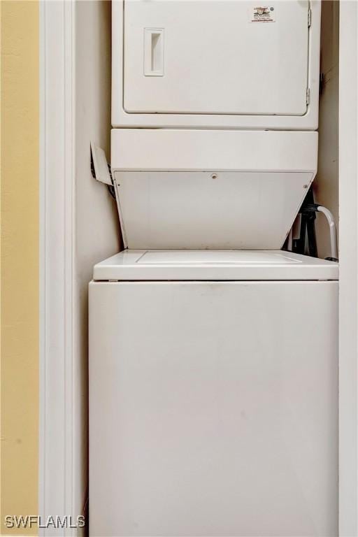 laundry area featuring stacked washer and clothes dryer