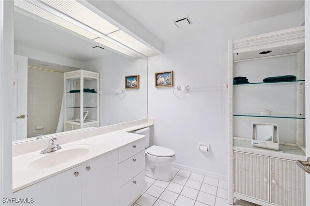 bathroom with a shower with curtain, visible vents, tile patterned flooring, vanity, and toilet