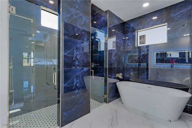 bathroom featuring tile walls and plus walk in shower