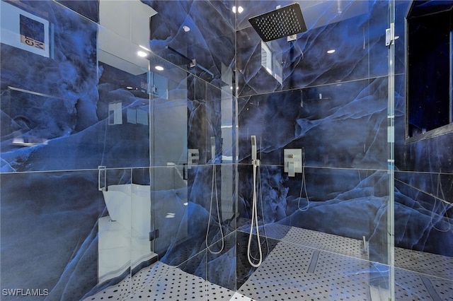 interior space with tiled shower