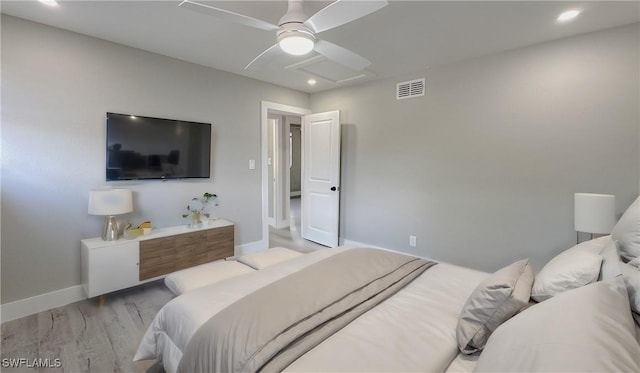 bedroom featuring ceiling fan and light hardwood / wood-style flooring