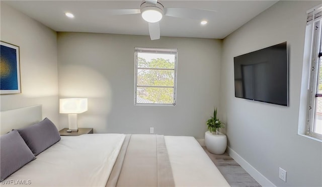 bedroom featuring light hardwood / wood-style flooring and ceiling fan