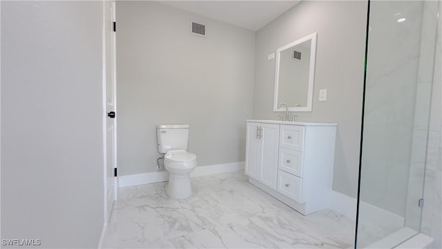 bathroom featuring vanity, toilet, and a shower