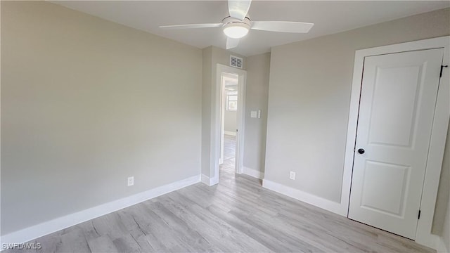 unfurnished bedroom featuring ceiling fan and light wood-type flooring