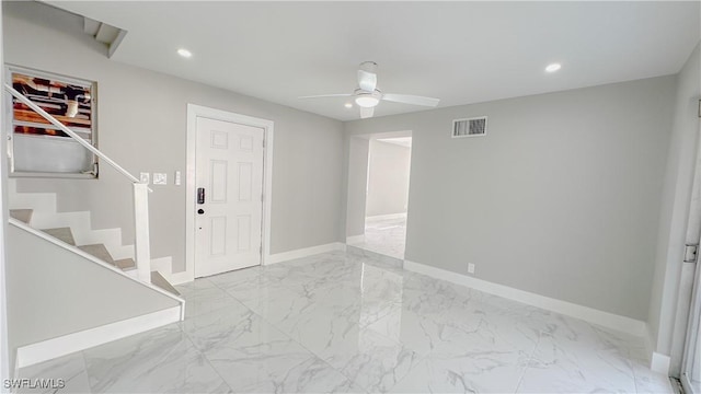 foyer entrance with ceiling fan