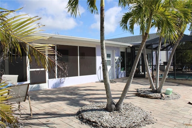 view of patio / terrace with a lanai