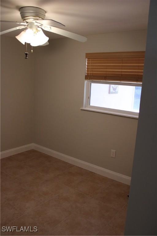 unfurnished room featuring ceiling fan