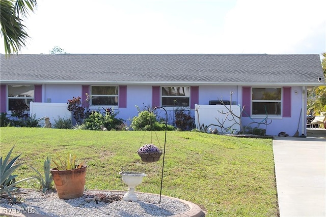 ranch-style house with a front yard