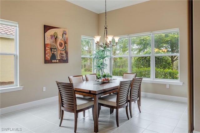 tiled dining area with a notable chandelier and a healthy amount of sunlight