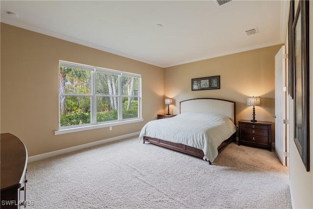 bedroom featuring crown molding and light colored carpet