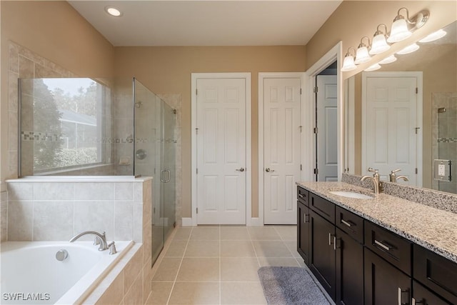 bathroom with vanity, tile patterned floors, and separate shower and tub