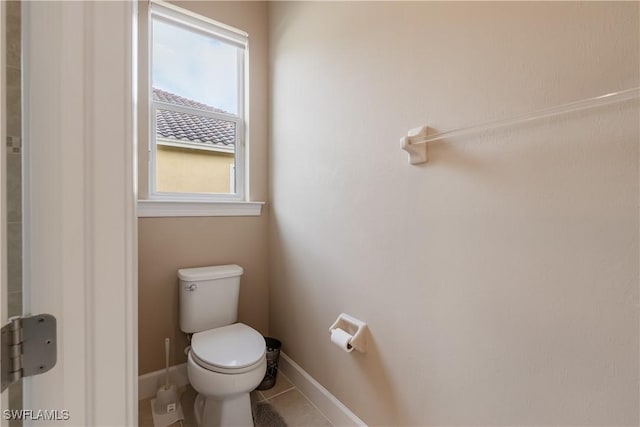 bathroom with tile patterned floors and toilet