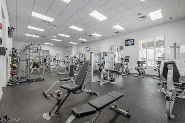 workout area featuring a drop ceiling