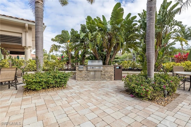 view of patio featuring a grill and exterior kitchen