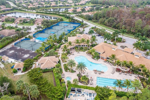 birds eye view of property with a water view