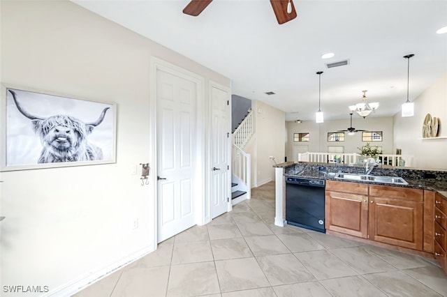 kitchen featuring a sink, visible vents, dishwasher, brown cabinetry, and pendant lighting