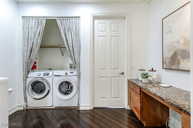 washroom featuring dark wood-type flooring and washer and dryer