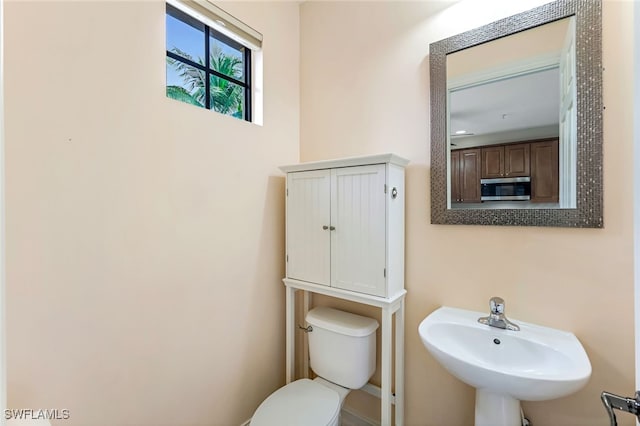 bathroom with sink and toilet