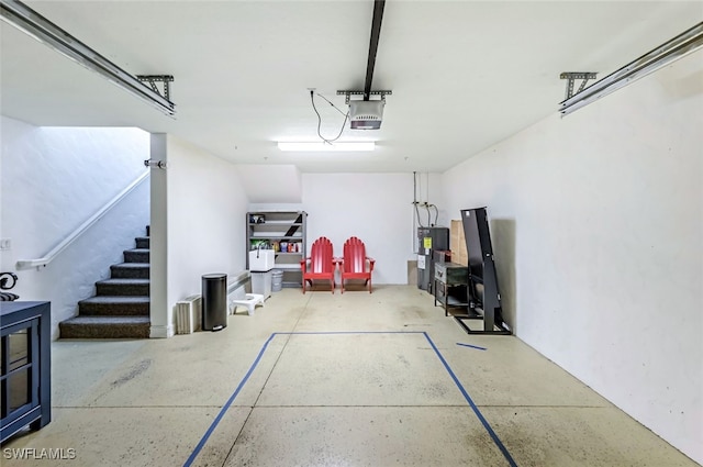 garage featuring a garage door opener and electric water heater