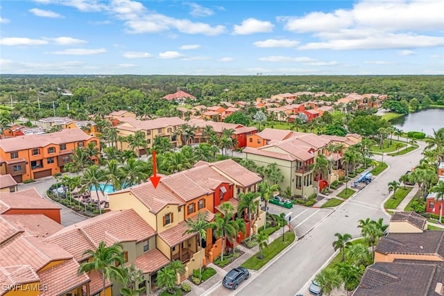 aerial view featuring a water view and a residential view